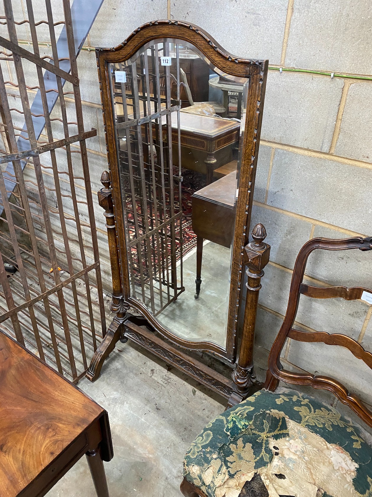 A 1920s oak cheval mirror, width 76cm, height 152cm *Please note the sale commences at 9am.
